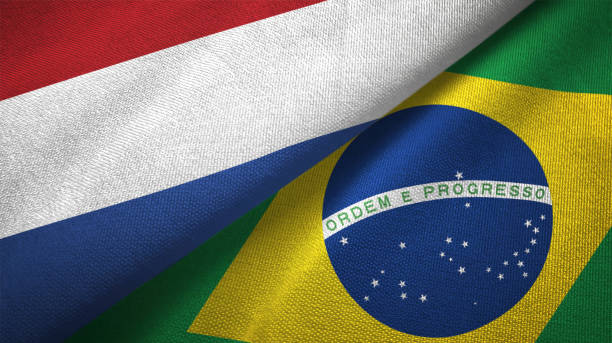 istock Brazil and Netherlands two flags together textile cloth fabric texture 1093316910