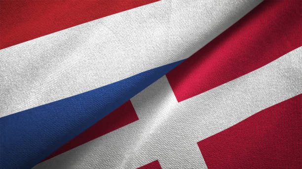 istock Denmark and Netherlands two flags together textile cloth fabric texture 1093317118