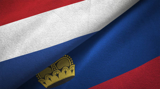 istock Liechtenstein and Netherlands two flags together textile cloth fabric texture 1093317538