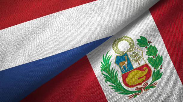 istock Peru and Netherlands two flags together textile cloth fabric texture 1093317744