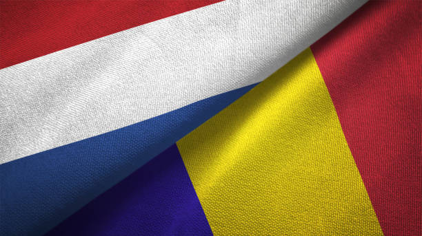 istock Romania and Netherlands two flags together textile cloth fabric texture 1093317748