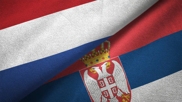 istock Serbia and Netherlands two flags together textile cloth fabric texture 1093317802