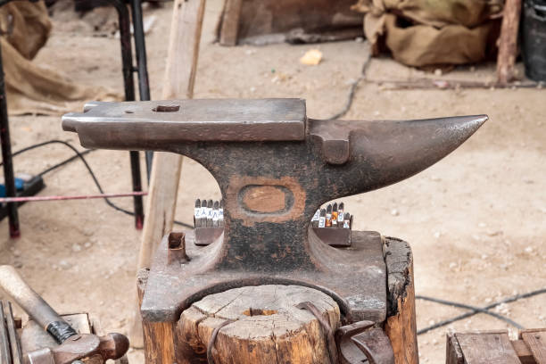istock outdoor scene with an old anvil on foreground 1093317862