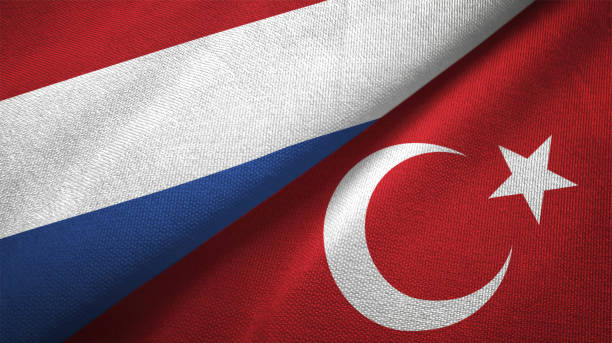 istock Turkey and Netherlands two flags together textile cloth fabric texture 1093317940