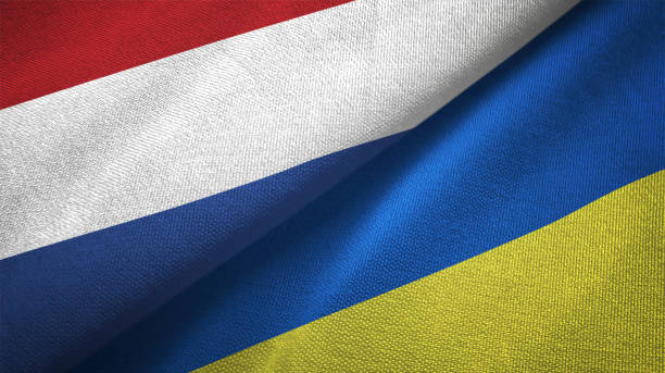 istock Ukraine and Netherlands two flags together textile cloth fabric texture 1093317974