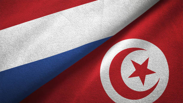 istock Tunisia and Netherlands two flags together textile cloth fabric texture 1093318022