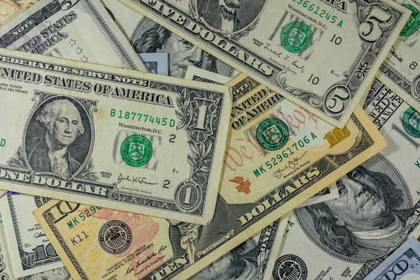 istock Background of different american dollar banknotes 1093319862