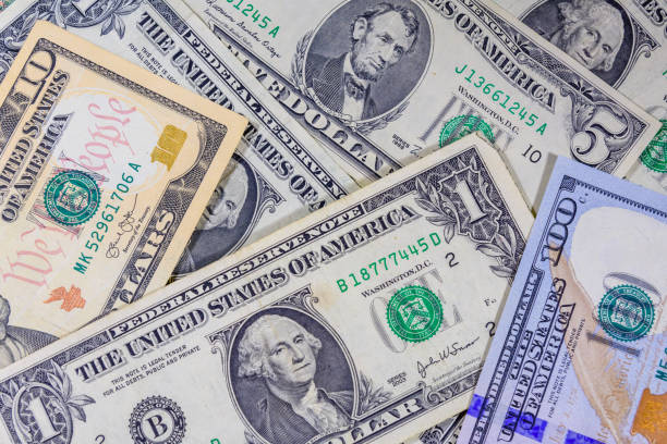 istock Background of different american dollar banknotes 1093319868