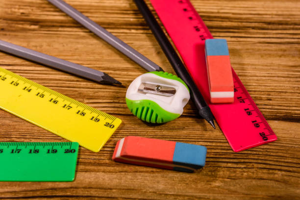 istock Rulers, pencils and erasers on a wooden table 1093319898