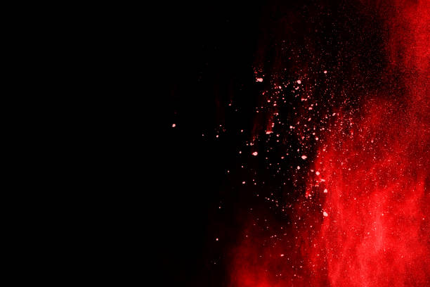 istock abstract red powder explosion on black background.abstract red powder splatted on black background. Freeze motion of red powder exploding. 1093320078