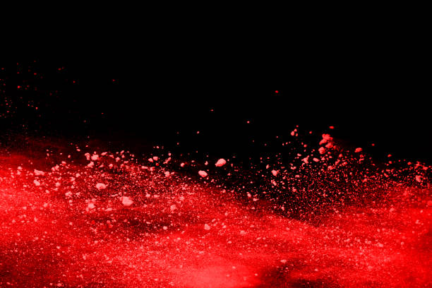 istock abstract red powder explosion on black background.abstract red powder splatted on black background. Freeze motion of red powder exploding. 1093320094