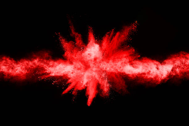 istock abstract red powder explosion on black background.abstract red powder splatted on black background. Freeze motion of red powder exploding. 1093320156