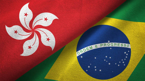 istock Brazil and Hong Kong two flags together textile cloth fabric texture 1093320232