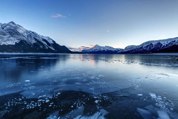 istock frozen lake with ice bubbles, Abraham Lake, Clearwater County, AB, Canada 1093320340