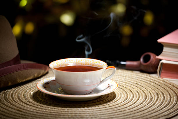 istock hot tea cup gold bokeh hat smoking pipe 1093322036