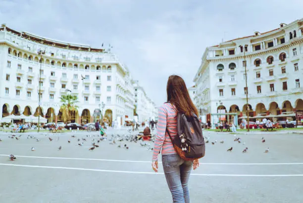 Young female tourist in Aristotle square in Thessaloniki, Greece