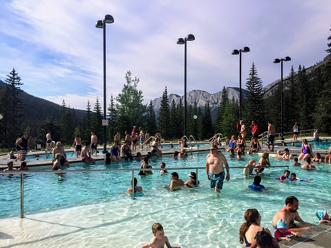 Miette Hot Springs, Jasper National Park, Alberta, Canada - July 5th, 2015: Miette Hot Springs are commercially developed hot springs located near Jasper. The pool is outdoors and very popular.