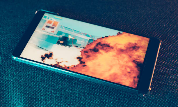 istock Close up of mobile phone showing a sequence from an action video game 1093332088