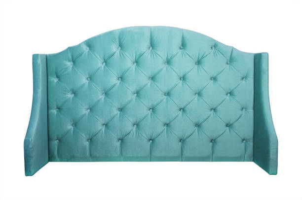 Teal velvet bed headboard isolated on white Shaped pastel teal blue color soft velvet fabric capitone bed headboard of Chesterfiels style sofa isolated on white background, front view head board bed blue stock pictures, royalty-free photos & images