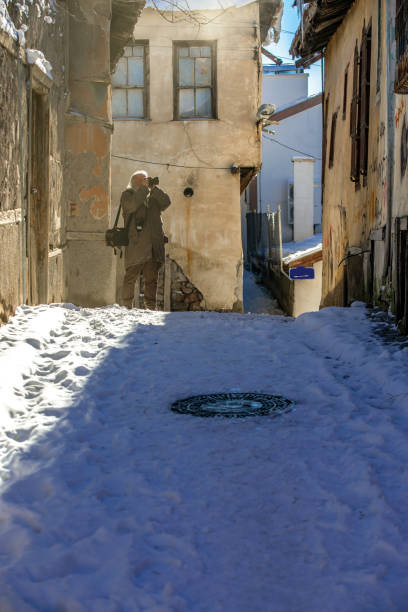 istock Senior Man Photographer with snow 1093338384
