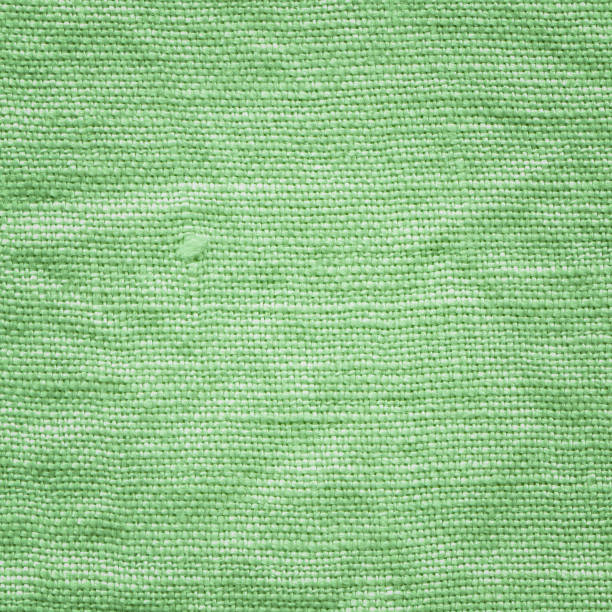 istock Closeup green fabric surface. Natural green linen texture 1093339432