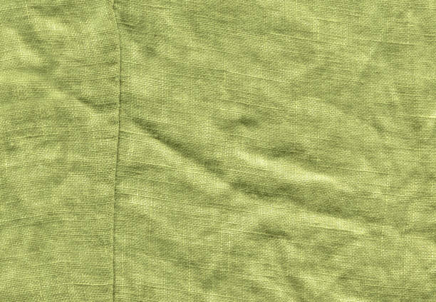 istock Closeup green fabric surface. Natural green linen texture 1093339986