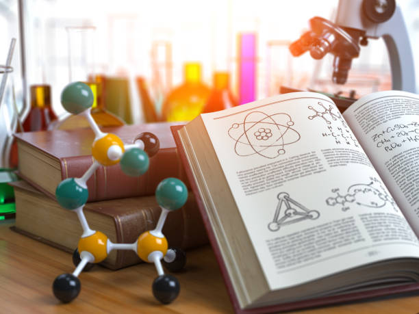 istock Chemistry .Laboratory equipment microscope with flasks, vials and model of molecule and book of chemistry. 1093344098