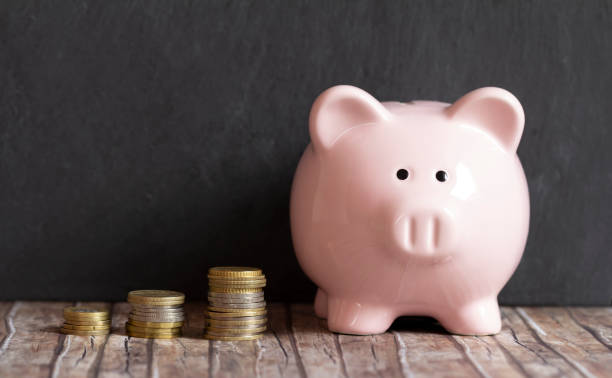 istock piggy bank and stack of coins 1093344472