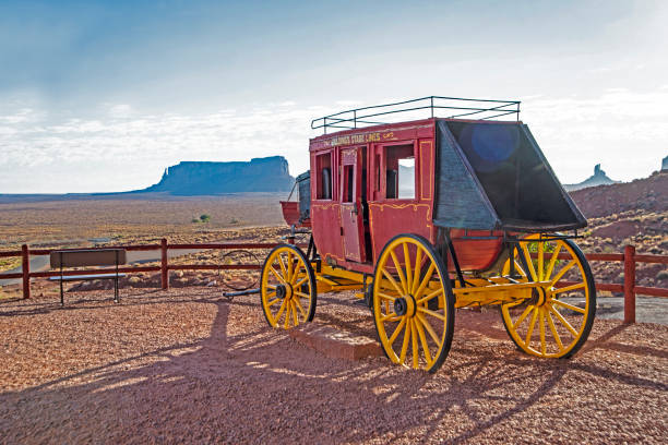 istock Scenic historic old red stage coach in Monument Valley 1093348680