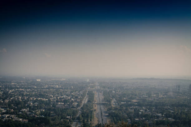Islamabad is the capital city of Pakistan, and is federally administered as part of the Islamabad Capital Territory. Built as a planned city in the 1960s to replace Karachi as Pakistan's capital, Islamabad is noted for its high standards of living, safety, and abundant greenery. Daman-e-Koh is a viewing point and hill top garden north of Islamabad and located in the middle of the Margalla Hills. Its name is a conjunction of two Persian words, which together means foot hills. It is about 2400ft from sea level and almost 500ft from the city of Islamabad.