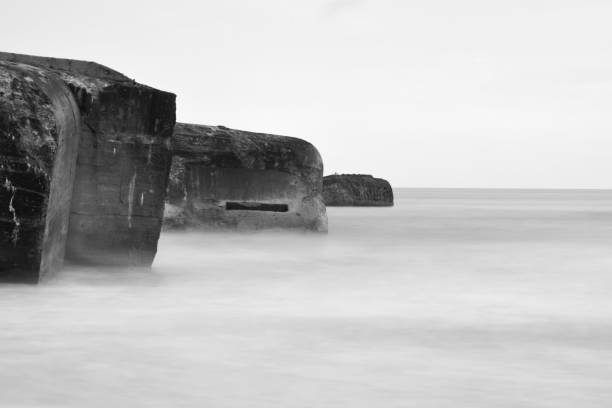 Sinking pride German bunker at Vigsø beach, North sea, Denmark. Taken with long exposure time on a stormy day. 2933 stock pictures, royalty-free photos & images