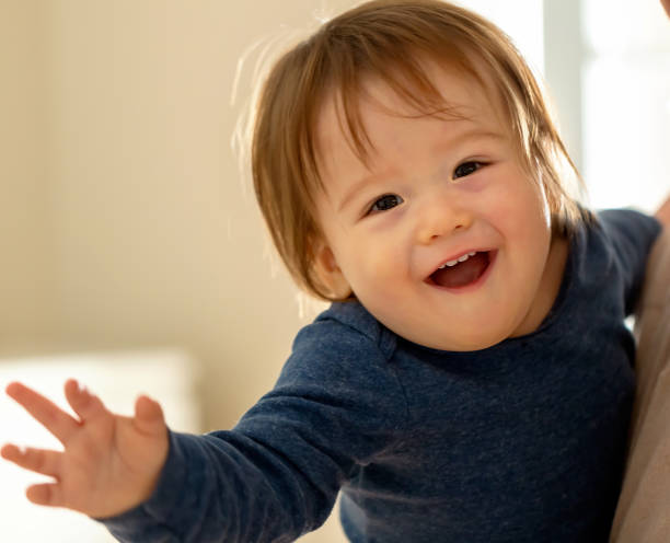 istock Happy toddler boy being held by his parents 1093363332