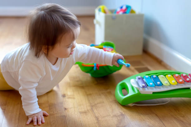 istock Toddler boy playing a musical instrument 1093363454