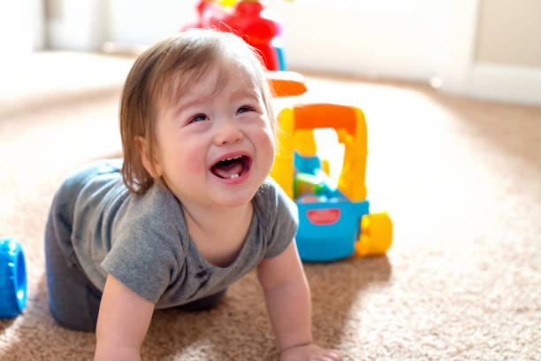 istock Crying toddler boy playing with his toys 1093363478