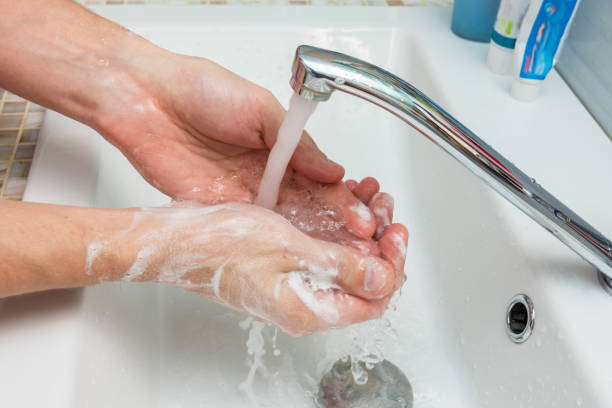 istock A man washes his hands from the thick suds 1093377250