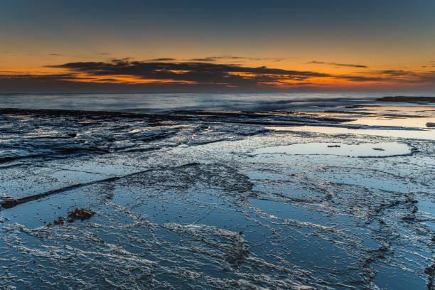 istock Bold and Dramatic Sunrise Seascape with Rock Ledge 1093381810