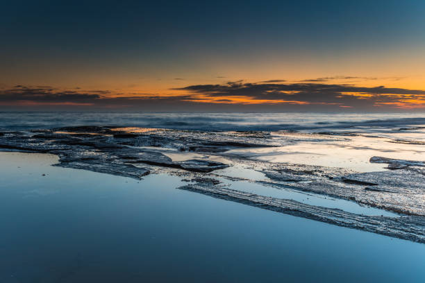 istock Bold and Dramatic Sunrise Seascape with Rock Ledge 1093381814