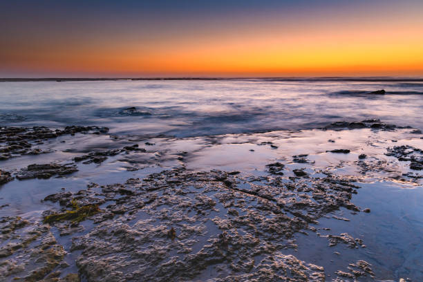 istock Sunrise Seascape and Rock Ledge 1093385282
