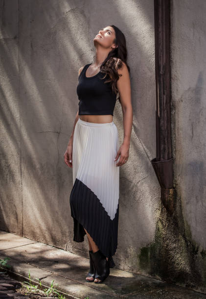 istock Beautiful Woman Leaning on Wall 1093385442