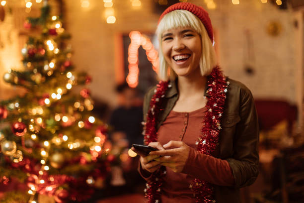 istock Girl with a phone looking at camera and smling 1093388356