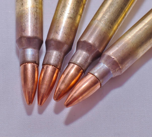 istock Four .223 caliber rifle bullets 1093393922