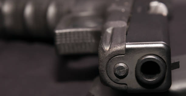 istock A black 9mm semiautomatic pistol laying in it's side 1093393924