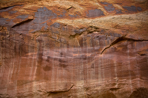 Red rock surface textures with cracks and erosion along the Church Rock Trails in Red Rock Park in Gallup, McKinley County, New Mexico, USA