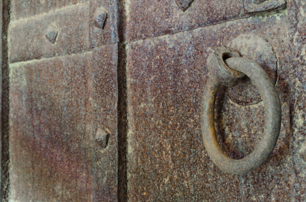 istock Old rusty massive wrought door to the temple 1093396952
