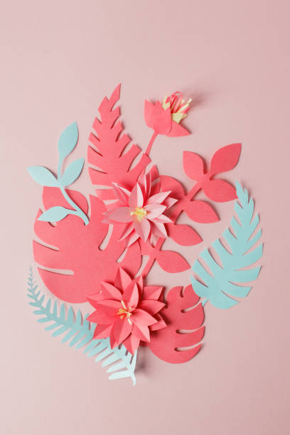 istock Exotic tropical multicolored leaf paper composition, creative application handcraft on a pink background with copy space. Greeting card. Flat lay, live coral concept 1093417402