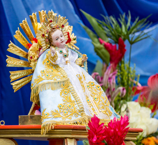 cuenca, ecuador / december 24, 2015 - famous statue of baby jesus is at the head of parade - parade doll child baby imagens e fotografias de stock