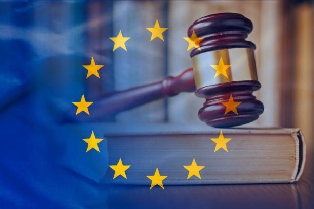 European Union flag with wooden gavel in close-up stock photo