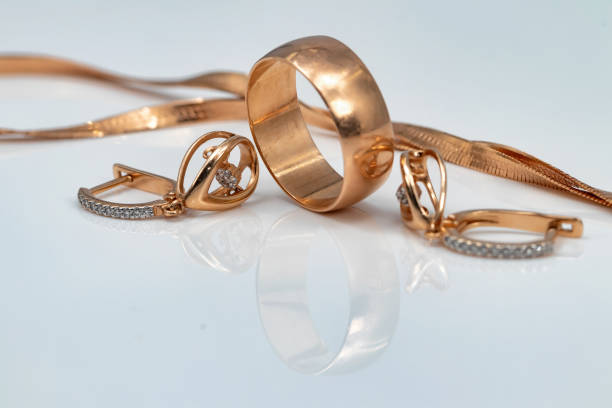istock earrings with dancing diamonds, gold ring and gold chain 1093453422