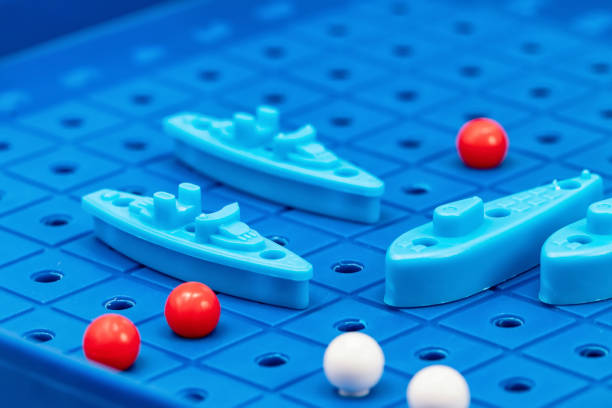 istock Toy war ships and submarine are placed on the blue  playing Board 1093455110