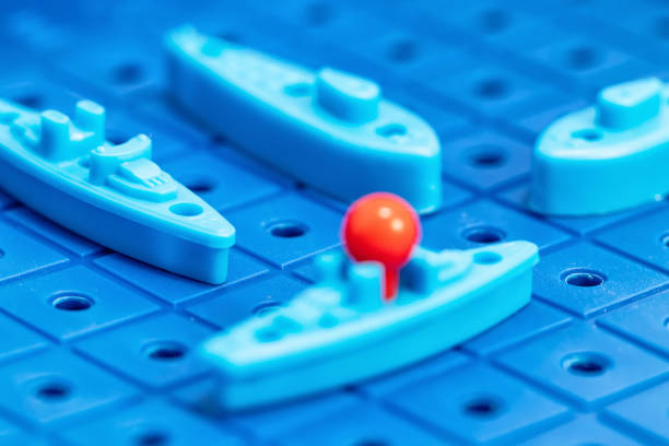 istock Toy war ships and submarine are placed on the blue  playing Board 1093455282